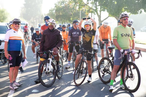 A group of bicycle riders resting with their bikes at the CSUN bikefest.