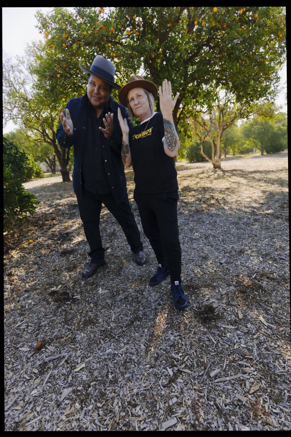 VERTICAL CHRIS PIERCE GARRISON STARR POSING IN ORANGE GROVE